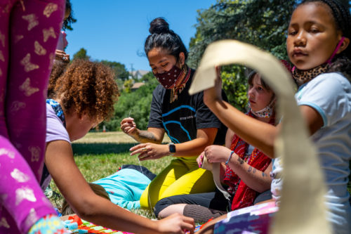 Camp Destiny - Leader Francesca teaching fashion and art with youth in the park